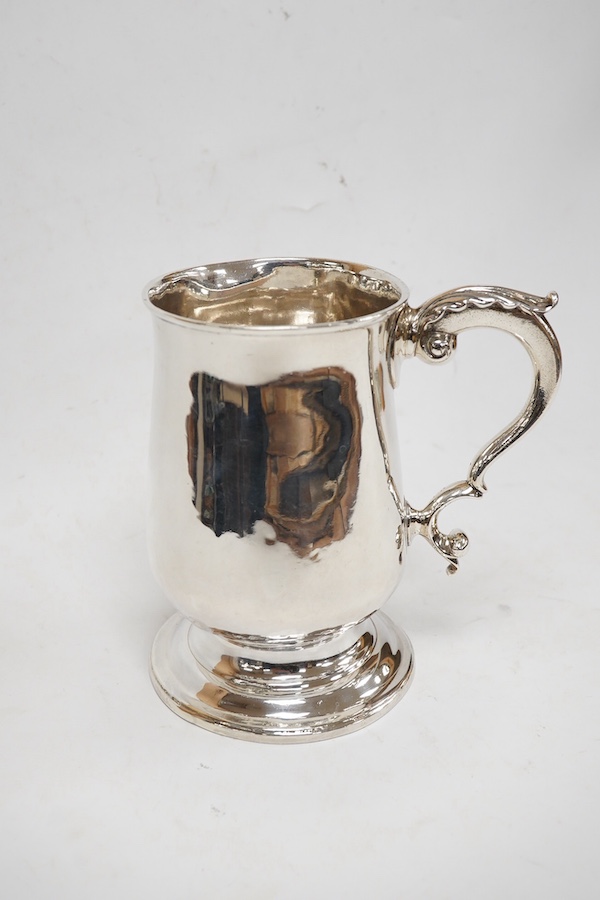 A George III silver baluster mug, with acanthus leaf capped handle, William Turton, London, 1782, height 15.5cm, 10.4oz. Condition - poor to fair